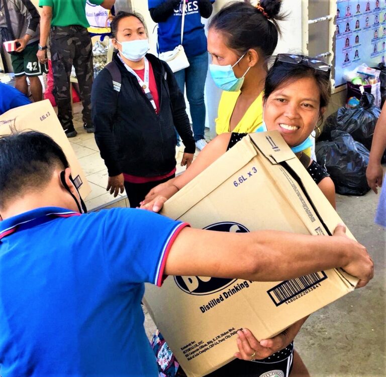 SM distributes boxes of water relief to Taal eruption victims  in Batangas, Lipa