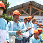 San Miguel Bohol Mondelez International 1 – community members receive tools