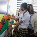 Modess Outreach – Girls creating the mural (2)