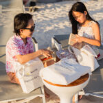 Sun Life client Jale Monique Abellas and sister Jhea unboxing some surprise gifts from Sun Life