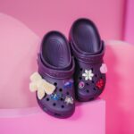 Jikamarie brings her trademark whimsy and eclectic style with her Classic Clogs in Dark Iris featuring Jibbitz