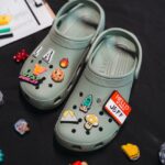 Lola Amour brings their retro-yet-modern aesthetic with the Classic Clogs in Moss Green decorated with Jibbitz
