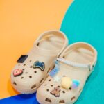 Maki brings nostalgia to the fore with his Classic Clogs in Tan decked in Jibbitz
