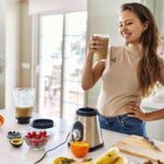Woman making a vanilla protein shake